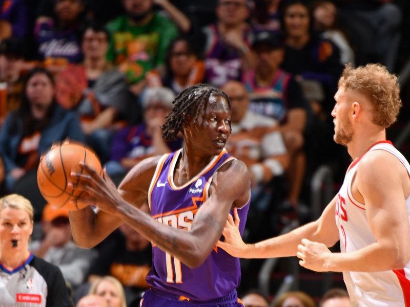 PHOENIX, AZ - MARCH 2: Bol Bol #11 of the Phoenix Suns handles the ball during the game against the Houston Rockets on March 2, 2024 at Footprint Center in Phoenix, Arizona. NOTE TO USER: User expressly acknowledges and agrees that, by downloading and or using this photograph, user is consenting to the terms and conditions of the Getty Images License Agreement. Mandatory Copyright Notice: Copyright 2024 NBAE (Photo by Barry Gossage/NBAE via Getty Images)