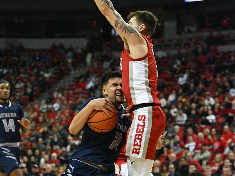 Jan 28, 2023; Las Vegas, Nevada, USA; Nevada Wolf Pack guard Jarod Lucas (2) collides with UNLV Runnin' Rebels guard Jordan McCabe (5) in the first half at Thomas & Mack Center. Mandatory Credit: Candice Ward-USA TODAY Sports