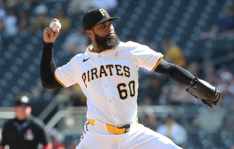May 11, 2025; Pittsburgh, Pennsylvania, USA;  Pittsburgh Pirates relief pitcher Dennis Santana (60) pitches against the Atlanta Braves during the ninth inning at PNC Park. Mandatory Credit: Charles LeClaire-Imagn Images