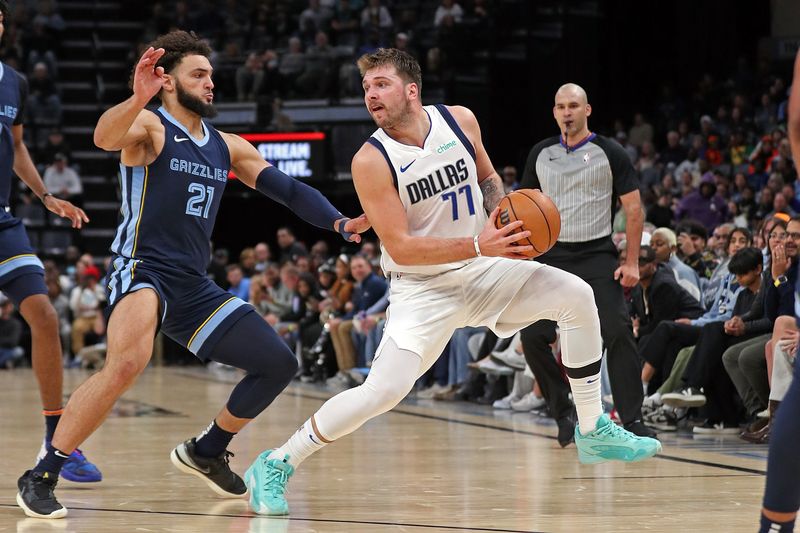 MEMPHIS, TENNESSEE - OCTOBER 30: Luka Doncic #77 of the Dallas Mavericks handles the ball against David Roddy #21 of the Memphis Grizzlies during the first half at FedExForum on October 30, 2023 in Memphis, Tennessee. NOTE TO USER: User expressly acknowledges and agrees that, by downloading and or using this photograph, User is consenting to the terms and conditions of the Getty Images License Agreement. (Photo by Justin Ford/Getty Images)