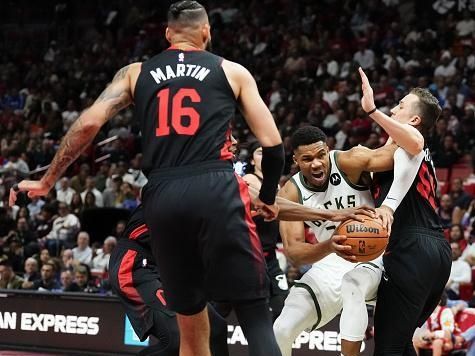 MIAMI, FLORIDA - NOVEMBER 28: Giannis Antetokounmpo #34 of the Milwaukee Bucks dribbles the ball against Duncan Robinson #55 of the Miami Heat in the first quarter during the NBA In-season Tournament game at Kaseya Center on November 28, 2023 in Miami, Florida. NOTE TO USER: User Expressly acknowledges and agrees that, by downloading and or using this photograh, User is consenting to the terms and conditions of the Getty Images License Agreement. (Photo by Rich Storry/Getty Images)