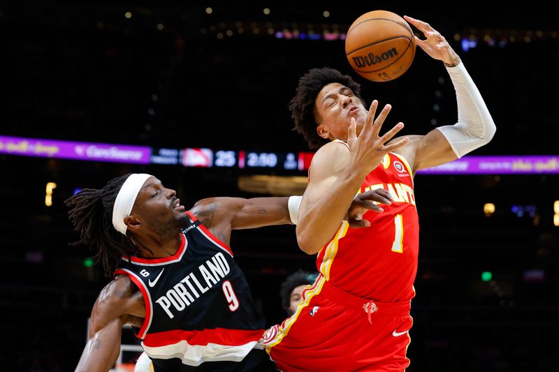 ATLANTA, GA - MARCH 03: Jalen Johnson #1 of the Atlanta Hawks battles Jerami Grant #9 of the Portland Trail Blazers for a rebound during the first half at State Farm Arena on March 3, 2023 in Atlanta, Georgia. NOTE TO USER: User expressly acknowledges and agrees that, by downloading and or using this photograph, User is consenting to the terms and conditions of the Getty Images License Agreement. (Photo by Todd Kirkland/Getty Images)