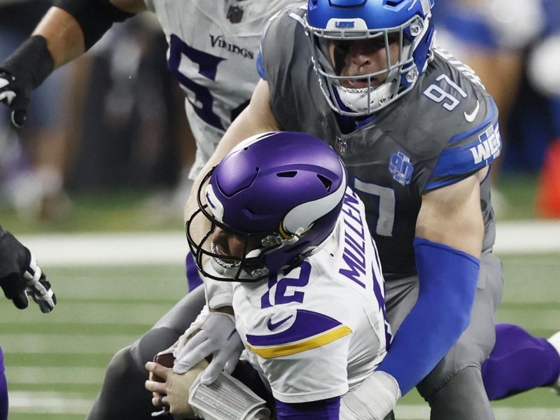 Detroit Lions defensive end Aidan Hutchinson (97) sacks Minnesota Vikings quarterback Nick Mullens (12) during the first half of an NFL football game Sunday, Jan. 7, 2024, in Detroit. (AP Photo/Duane Burleson)