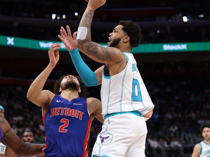 DETROIT, MICHIGAN - JANUARY 03: Miles Bridges #0 of the Charlotte Hornets drives to the basket against Cade Cunningham #2 of the Detroit Pistons during the first half at Little Caesars Arena on January 03, 2025 in Detroit, Michigan. NOTE TO USER: User expressly acknowledges and agrees that, by downloading and or using this photograph, User is consenting to the terms and conditions of the Getty Images License. (Photo by Gregory Shamus/Getty Images)