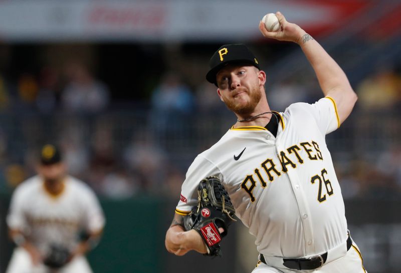 Aug 6, 2024; Pittsburgh, Pennsylvania, USA;  Pittsburgh Pirates starting pitcher Bailey Falter (26) delivers a pitch against the San Diego Padres during the first inning at PNC Park. Mandatory Credit: Charles LeClaire-USA TODAY Sports