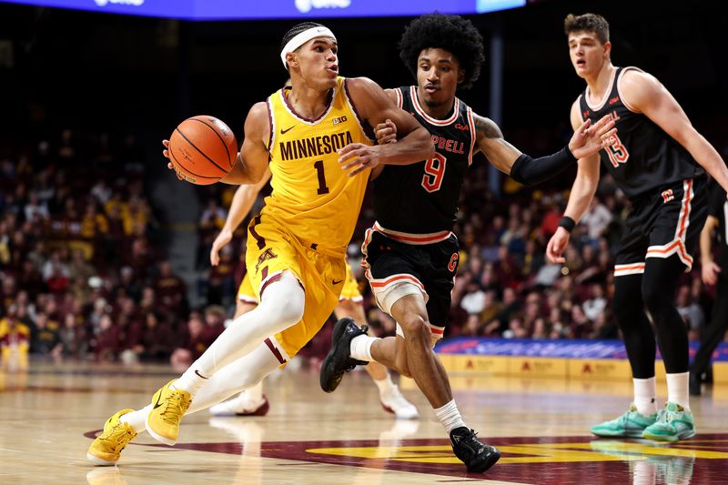 Dec 21, 2025; Minneapolis, Minnesota, USA; Minnesota Golden Gophers guard Isaac Asuma (1) works around Campbell Fighting Camels guard D.J. Smith (9) during the first half at Williams Arena. Mandatory Credit: Matt Krohn-Imagn Images