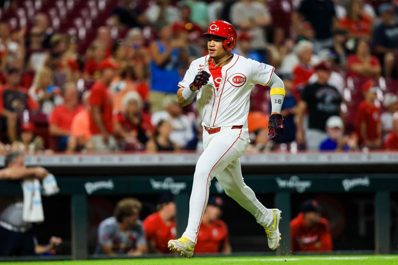 Aug 14, 2024; Cincinnati, Ohio, USA; Cincinnati Reds third baseman Noelvi Marte (16) scores on a RBI double hit by shortstop Elly De La Cruz (not pictured) in the eighth inning against the St. Louis Cardinals at Great American Ball Park. Mandatory Credit: Katie Stratman-USA TODAY Sports