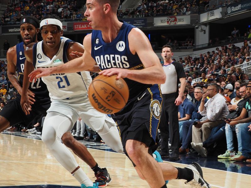 INDIANAPOLIS, IN - MARCH 27: T.J. McConnell #9 of the Indiana Pacers dribbles the ball during the game against the Dallas Mavericks on March 27, 2023 at Gainbridge Fieldhouse in Indianapolis, Indiana. NOTE TO USER: User expressly acknowledges and agrees that, by downloading and or using this Photograph, user is consenting to the terms and conditions of the Getty Images License Agreement. Mandatory Copyright Notice: Copyright 2023 NBAE (Photo by Ron Hoskins/NBAE via Getty Images)