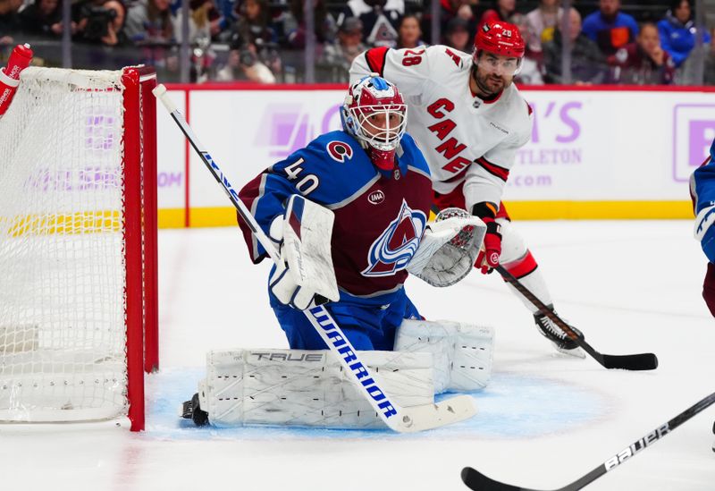 Nov 9, 2024; Denver, Colorado, USA; Colorado Avalanche goaltender Alexandar Georgiev (40) defends his net in the first period against the Carolina Hurricanes at Ball Arena. Mandatory Credit: Ron Chenoy-Imagn Images