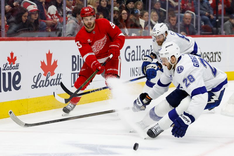 Jan 25, 2025; Detroit, Michigan, USA;  Detroit Red Wings right wing Alex DeBrincat (93) passes the puck in the second period against the Tampa Bay Lightning at Little Caesars Arena. Mandatory Credit: Rick Osentoski-Imagn Images