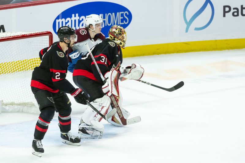 Mar 20, 2025; Ottawa, Ontario, CAN; Ottawa Senators defenseman Artem Zub and goalie Anton Forsberg (31) follow the puck as Colorado Avalanche left wing Joel Kiviranta (94) wait for an opportunity to strike in the third period at the Canadian Tire Centre. Mandatory Credit: Marc DesRosiers-Imagn Images