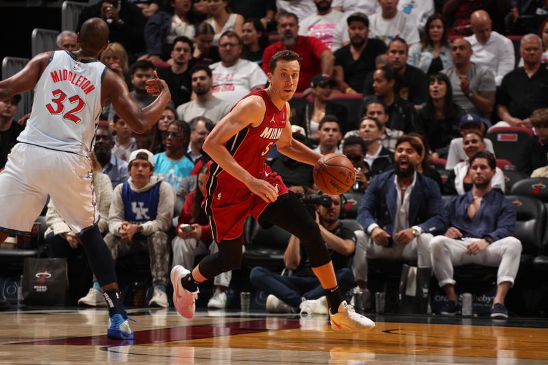 MIAMI, FL - MARCH 3: Duncan Robinson #55 of the Miami Heat dribbles the ball during the game against the Washington Wizards on March 3, 2025 at Kaseya Center in Miami, Florida. NOTE TO USER: User expressly acknowledges and agrees that, by downloading and or using this Photograph, user is consenting to the terms and conditions of the Getty Images License Agreement. Mandatory Copyright Notice: Copyright 2025 NBAE (Photo by Issac Baldizon/NBAE via Getty Images)