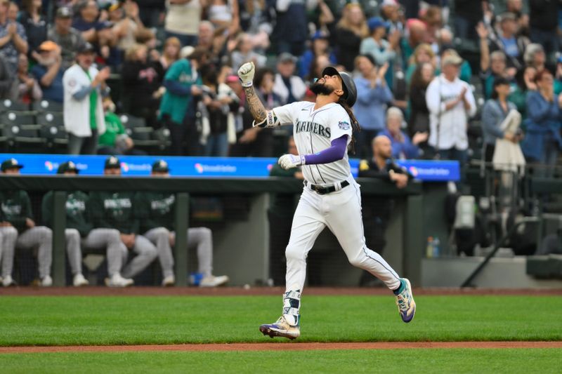 Aug 28, 2023; Seattle, Washington, USA; Seattle Mariners shortstop J.P. Crawford (3) heads towards home plate after hitting a home run against the Oakland Athletics during the first inning at T-Mobile Park. Mandatory Credit: Steven Bisig-USA TODAY Sports