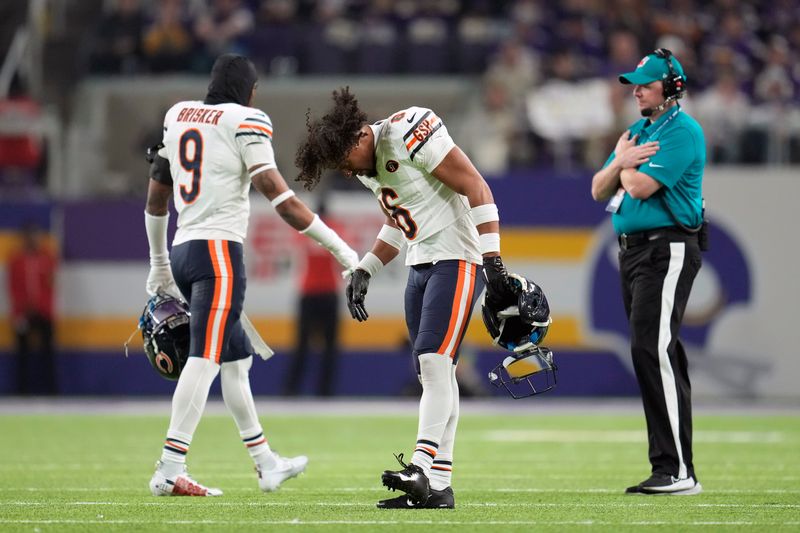 Chicago Bears cornerback Kyler Gordon (6) reacts after being called for a penalty during the first half of an NFL football game against the Minnesota Vikings, Monday, Nov. 27, 2023, in Minneapolis. (AP Photo/Abbie Parr)