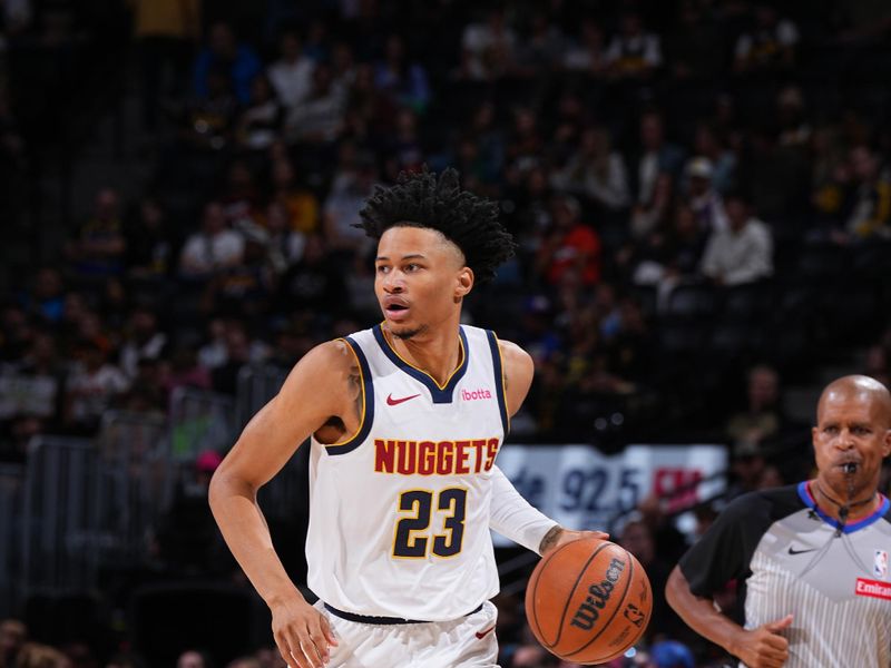 DENVER, CO - OCTOBER 13: Trey Alexander #23 of the Denver Nuggets dribbles the ball during the game against the Phoenix Suns on October 13, 2024 at Ball Arena in Denver, Colorado. NOTE TO USER: User expressly acknowledges and agrees that, by downloading and/or using this Photograph, user is consenting to the terms and conditions of the Getty Images License Agreement. Mandatory Copyright Notice: Copyright 2024 NBAE (Photo by Garrett Ellwood/NBAE via Getty Images)