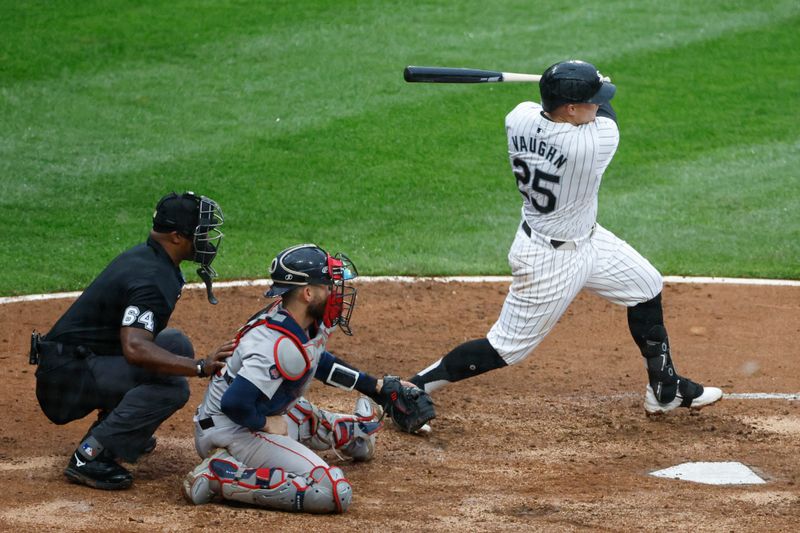 Jun 8, 2024; Chicago, Illinois, USA; Chicago White Sox first baseman Andrew Vaughn (25) hits an RBI-single against the Boston Red Sox during the fifth inning at Guaranteed Rate Field. Mandatory Credit: Kamil Krzaczynski-USA TODAY Sports