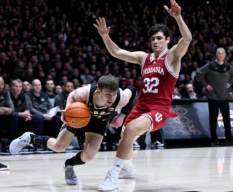 Feb 25, 2023; West Lafayette, Indiana, USA; Purdue Boilermakers guard Braden Smith (3) drives the ball around Indiana Hoosiers guard Trey Galloway (32) during the second half at Mackey Arena. Indiana won 79-71. Mandatory Credit: Marc Lebryk-USA TODAY Sports