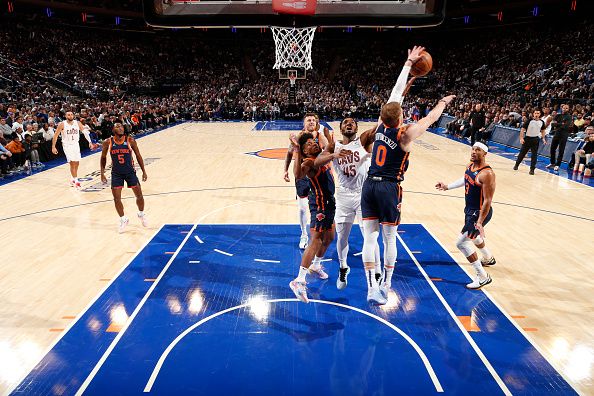 NEW YORK, NY - NOVEMBER 1: Donte Divincenzo #0 of the New York Knicks blocks the shot by Donovan Mitchell #45 of the Cleveland Cavaliers during the game on November 1, 2023 at Madison Square Garden in New York City, New York.  NOTE TO USER: User expressly acknowledges and agrees that, by downloading and or using this photograph, User is consenting to the terms and conditions of the Getty Images License Agreement. Mandatory Copyright Notice: Copyright 2023 NBAE  (Photo by Nathaniel S. Butler/NBAE via Getty Images)