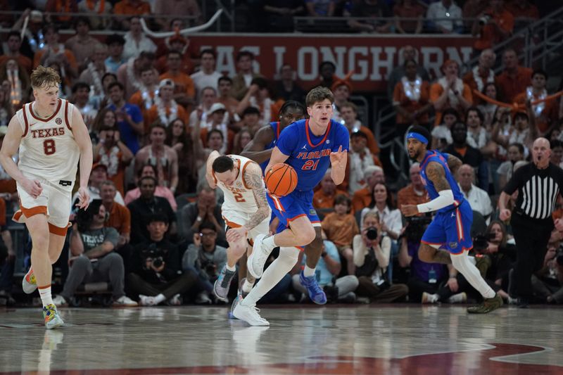 Feb 25, 2026; Austin, Texas, USA; Florida Gators forward Alex Condon (21) drives the ball up court during the second half against the Texas Longhorns at Moody Center. Mandatory Credit: Dustin Safranek-Imagn Images