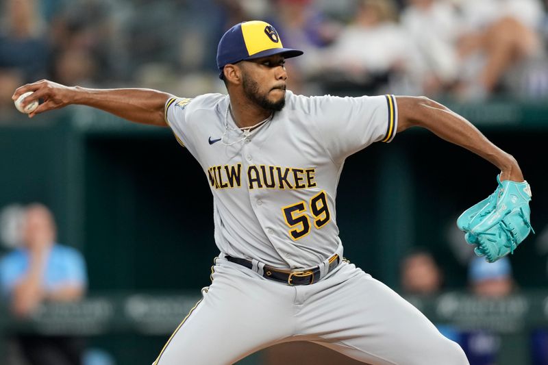 Aug 20, 2023; Arlington, Texas, USA; Milwaukee Brewers relief pitcher Elvis Peguero (59) delivers a pitch to the Texas Rangers during the eighth inning at Globe Life Field. Mandatory Credit: Jim Cowsert-USA TODAY Sports