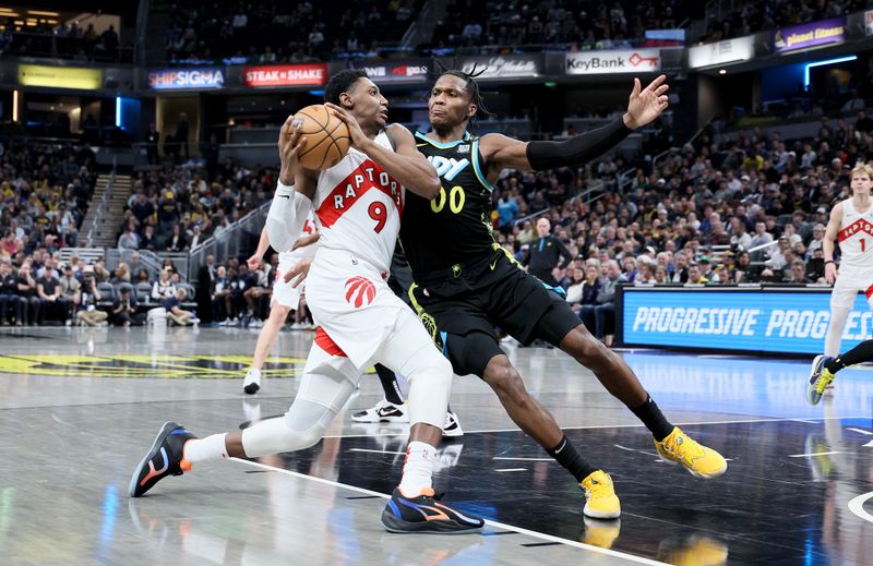 INDIANAPOLIS, INDIANA - FEBRUARY 26:  RJ Barrett #9 of the Toronto Raptors shoots the ball while defended by Bennedict Mathurin #00 of the Indiana Pacers at Gainbridge Fieldhouse on February 26, 2024 in Indianapolis, Indiana.    NOTE TO USER: User expressly acknowledges and agrees that, by downloading and or using this photograph, User is consenting to the terms and conditions of the Getty Images License Agreement.  (Photo by Andy Lyons/Getty Images)