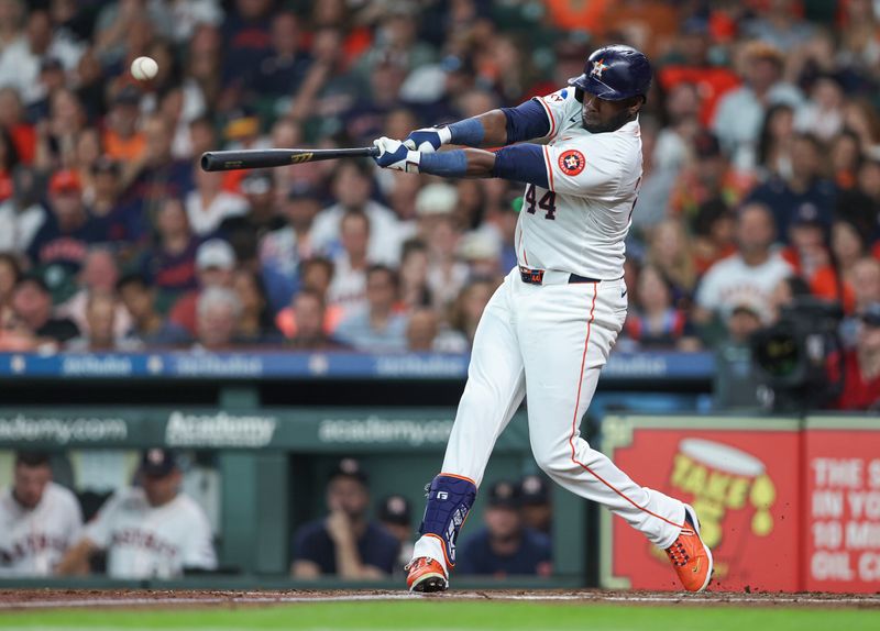 Aug 17, 2024; Houston, Texas, USA; Houston Astros left fielder Yordan Alvarez (44) hits an RBI single during the third inning against the Chicago White Sox at Minute Maid Park. Mandatory Credit: Troy Taormina-USA TODAY Sports