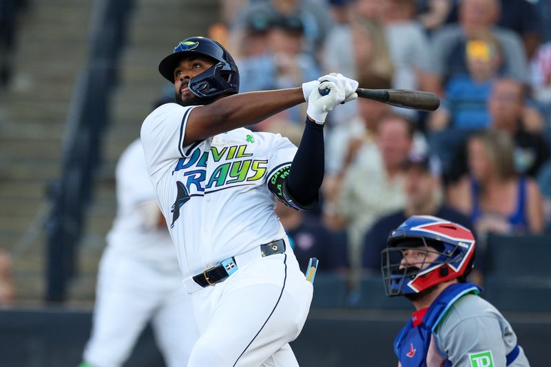 May 24, 2025; Tampa, Florida, USA; Tampa Bay Rays third baseman Junior Caminero (13) hits a three run home run against the Toronto Blue Jays in the first inning at George M. Steinbrenner Field. Mandatory Credit: Nathan Ray Seebeck-Imagn Images