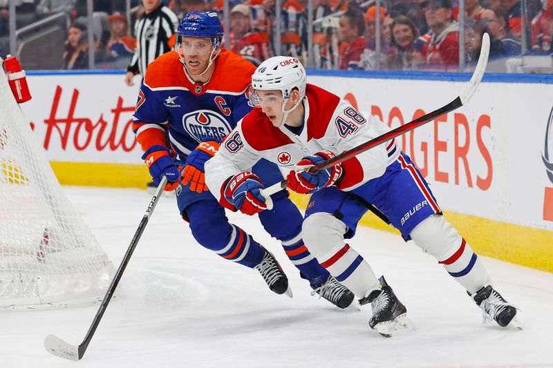 Mar 6, 2025; Edmonton, Alberta, CAN; Montreal Canadiens defensemen Lane Hutton (48) and Edmonton Oilers forward Connor McDavid (97) look for a loose puck during the first period at Rogers Place. Mandatory Credit: Perry Nelson-Imagn Images