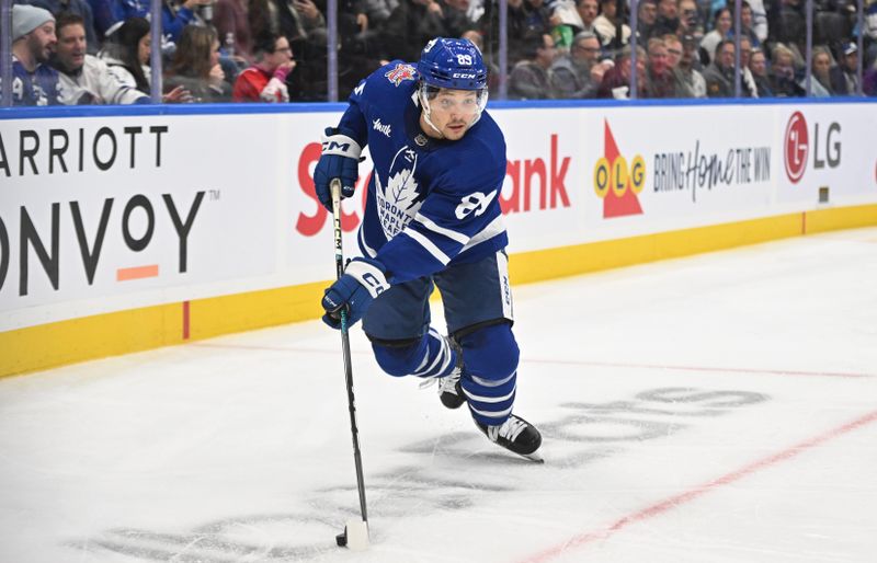 Nov 8, 2023; Toronto, Ontario, CAN; Toronto Maple Leafs forward Nick Robertson (89) skates with the puck against the Ottawa Senators in the third period at Scotiabank Arena. Mandatory Credit: Dan Hamilton-USA TODAY Sports