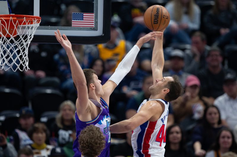 SALT LAKE CITY UT- NOVEMBER 23:  Walker Kessler #24 of the Utah Jazz blocks a shot by Bojan Bogdanovic #44 of the Detroit Pistons during the first half of their game November 23, 2022  at the Vivint Arena in Salt Lake City, Utah. NOTE TO USER: User expressly acknowledges and agrees that, by downloading and using this photograph, User is consenting to the terms and conditions of the Getty Images License Agreement (Photo by Chris Gardner/ Getty Images)