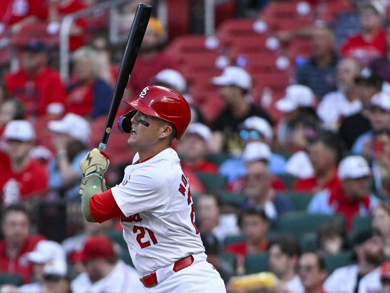 May 17, 2024; St. Louis, Missouri, USA;  St. Louis Cardinals right fielder Lars Nootbaar (21) hits a two run home run against the Boston Red Sox during the first inning at Busch Stadium. Mandatory Credit: Jeff Curry-USA TODAY Sports