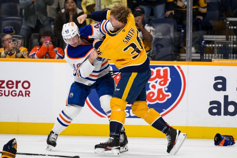 Oct 31, 2024; Nashville, Tennessee, USA;  Nashville Predators left wing Cole Smith (36) and Edmonton Oilers defenseman Ty Emberson (49) exchange blows uring the first period at Bridgestone Arena. Mandatory Credit: Steve Roberts-Imagn Images