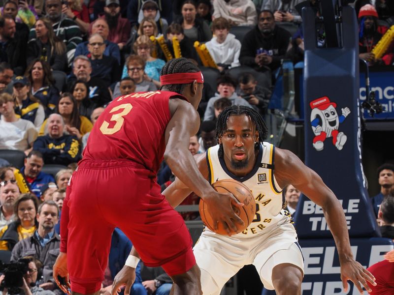 INDIANAPOLIS, IN - MARCH 18:  Aaron Nesmith #23 of the Indiana Pacers plays defense during the game  against Caris LeVert #3 of the Cleveland Cavaliers on March 18, 2024 at Gainbridge Fieldhouse in Indianapolis, Indiana. NOTE TO USER: User expressly acknowledges and agrees that, by downloading and or using this Photograph, user is consenting to the terms and conditions of the Getty Images License Agreement. Mandatory Copyright Notice: Copyright 2024 NBAE (Photo by Ron Hoskins/NBAE via Getty Images)