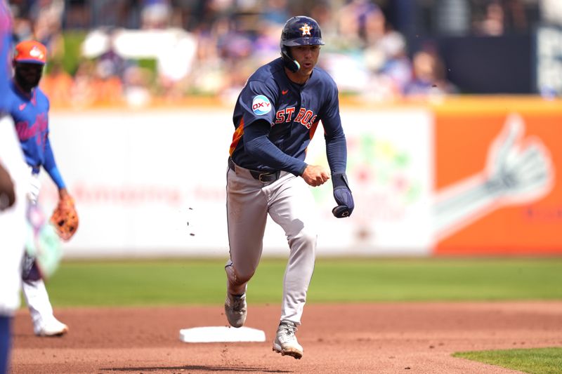 Mar 1, 2026; Port St. Lucie, Florida, USA;  Houston Astros left fielder Joey Loperfido (31) takes off to third base after the Mets botch a double play attempt in the second inning at Clover Park. Mandatory Credit: Jim Rassol-Imagn Images