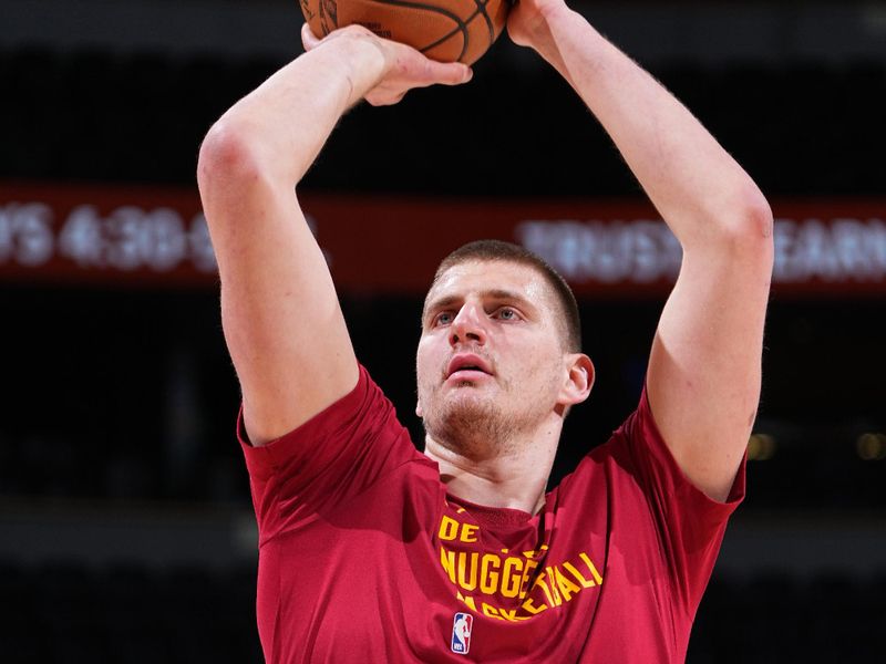 DENVER, CO - FEBRUARY 22: Nikola Jokic #15 of the Denver Nuggets warms up before the game against the Washington Wizards on February 22, 2024 at the Ball Arena in Denver, Colorado. NOTE TO USER: User expressly acknowledges and agrees that, by downloading and/or using this Photograph, user is consenting to the terms and conditions of the Getty Images License Agreement. Mandatory Copyright Notice: Copyright 2024 NBAE (Photo by Garrett Ellwood/NBAE via Getty Images)