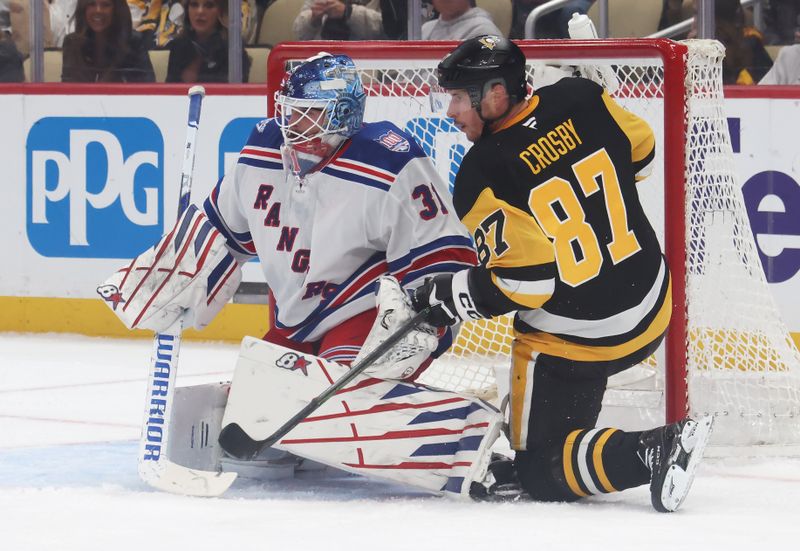 Oct 11, 2025; Pittsburgh, Pennsylvania, USA;  New York Rangers goaltender Igor Shesterkin (31) defends the net against Pittsburgh Penguins center Sidney Crosby (87) during the first period at PPG Paints Arena. Mandatory Credit: Charles LeClaire-Imagn Images