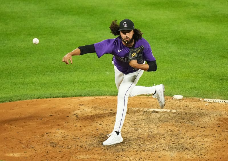 Aug 14, 2023; Denver, Colorado, USA; Colorado Rockies relief pitcher Justin Lawrence (61) delivers a pitch in the ninth inning against the Arizona Diamondbacks at Coors Field. Mandatory Credit: Ron Chenoy-USA TODAY Sports