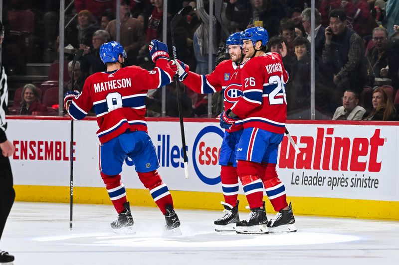 Dec 2, 2023; Montreal, Quebec, CAN; Montreal Canadiens right wing Joel Armia (40) celebrates his goal against the Detroit Red Wings with defenseman Johnathan Kovacevic (26) and defenseman Mike Matheson (8) during the second period at Bell Centre. Mandatory Credit: David Kirouac-USA TODAY Sports