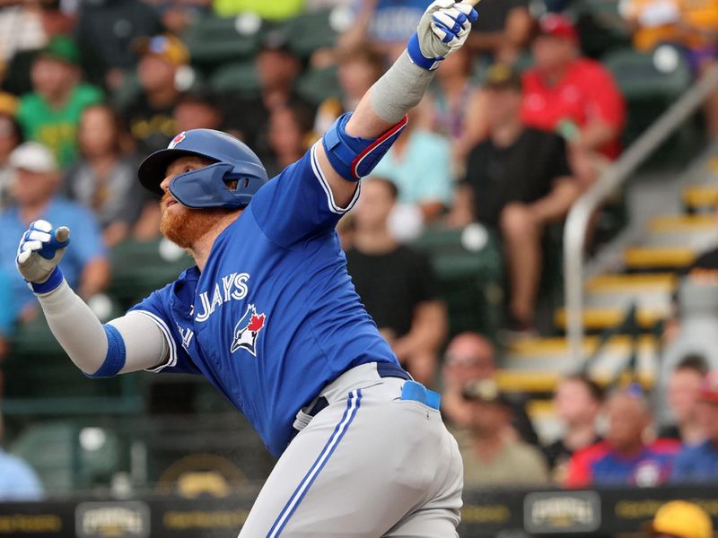 Mar 21, 2024; Bradenton, Florida, USA; Toronto Blue Jays third baseman Justin Turner (2)  hits a 2-run home run during the first inning against the Pittsburgh Pirates at LECOM Park. Mandatory Credit: Kim Klement Neitzel-USA TODAY Sports