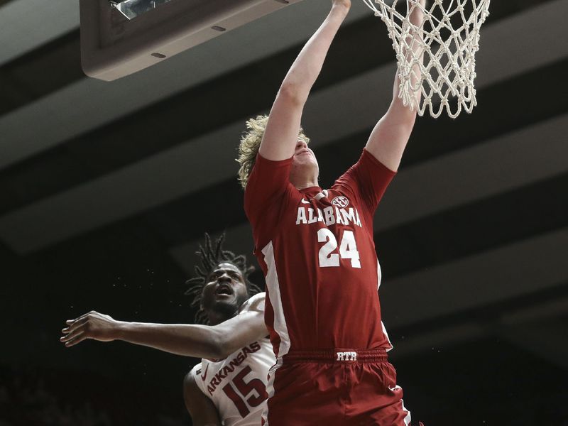 Mar 9, 2024; Tuscaloosa, Alabama, USA;  Alabama forward Sam Walters (24) goes to the rim with Arkansas forward Makhi Mitchell (15) defending at Coleman Coliseum. Alabama came from behind to win on overtime 92-88. Mandatory Credit: Gary Cosby Jr.-USA TODAY Sports