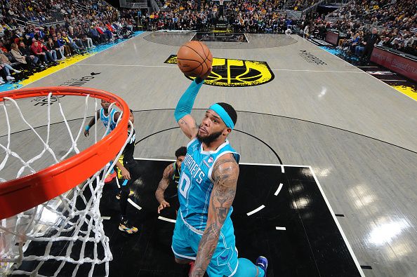 INDIANAPOLIS, IN - DECEMBER 20: Miles Bridges #0 of the Charlotte Hornets dunks the ball during the game against the Indiana Pacers on December 20, 2023 at Gainbridge Fieldhouse in Indianapolis, Indiana. NOTE TO USER: User expressly acknowledges and agrees that, by downloading and or using this Photograph, user is consenting to the terms and conditions of the Getty Images License Agreement. Mandatory Copyright Notice: Copyright 2023 NBAE (Photo by Ron Hoskins/NBAE via Getty Images)