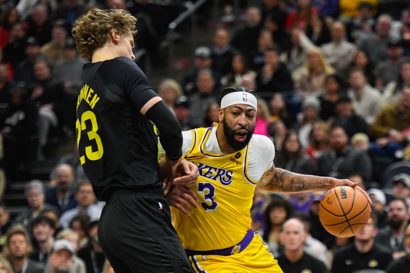 SALT LAKE CITY, UTAH - FEBRUARY 14: Anthony Davis #3 of the Los Angeles Lakers drives into Lauri Markkanen #23 of the Utah Jazz during the first half of a game at Delta Center on February 14, 2024 in Salt Lake City, Utah. NOTE TO USER: User expressly acknowledges and agrees that, by downloading and or using this photograph, User is consenting to the terms and conditions of the Getty Images License Agreement. (Photo by Alex Goodlett/Getty Images)