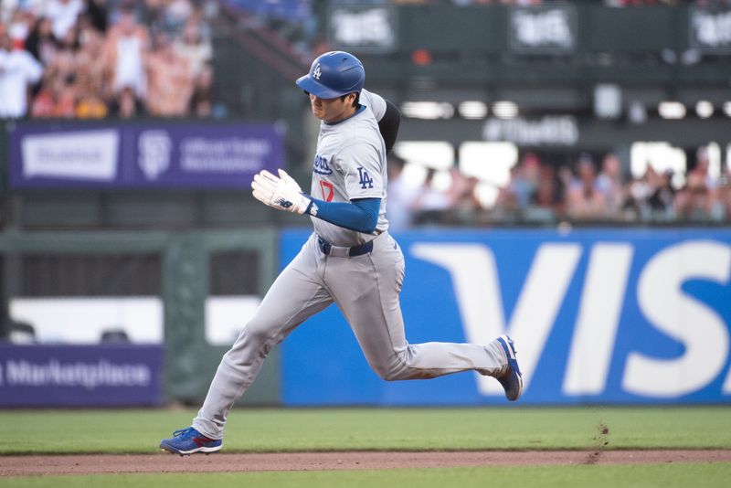 Jun 29, 2024; San Francisco, California, USA; Los Angeles Dodgers two-way player Shohei Ohtani (17) rounds second base during the tenth inning against the San Francisco Giants at Oracle Park. Mandatory Credit: Ed Szczepanski-USA TODAY Sports