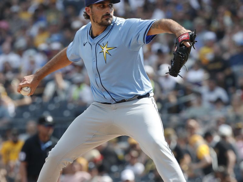 Jun 22, 2024; Pittsburgh, Pennsylvania, USA;  Tampa Bay Rays starting pitcher Zach Eflin (24) delivers a pitch against the Pittsburgh Pirates during the first inning at PNC Park. Mandatory Credit: Charles LeClaire-USA TODAY Sports