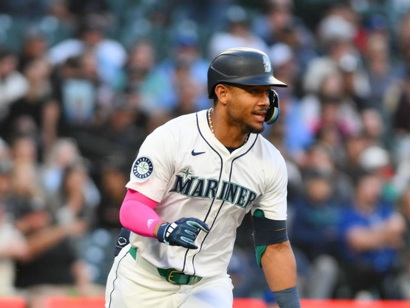 May 14, 2024; Seattle, Washington, USA; Seattle Mariners center fielder Julio Rodriguez (44) runs towards first base after hitting a single against the Kansas City Royals during the sixth inning at T-Mobile Park. Mandatory Credit: Steven Bisig-USA TODAY Sports