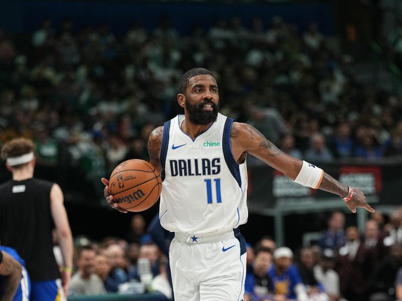 DALLAS, TX - MARCH 13: Kyrie Irving #11 of the Dallas Mavericks dribbles the ball during the game against the Golden State Warriors on March 13, 2024 at the American Airlines Center in Dallas, Texas. NOTE TO USER: User expressly acknowledges and agrees that, by downloading and or using this photograph, User is consenting to the terms and conditions of the Getty Images License Agreement. Mandatory Copyright Notice: Copyright 2024 NBAE (Photo by Glenn James/NBAE via Getty Images)