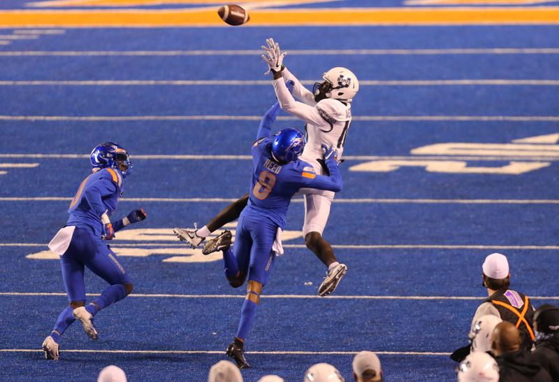 Oct 24, 2020; Boise, Idaho, USA; Utah State Aggies wide receiver Justin McGriff (10) attempts to make a catch over Boise State Broncos linebacker Brock Miller (9) during the second half at Albertsons Stadium. Boise State defeats Utah State 42-13. Mandatory Credit: Brian Losness-USA TODAY Sport
