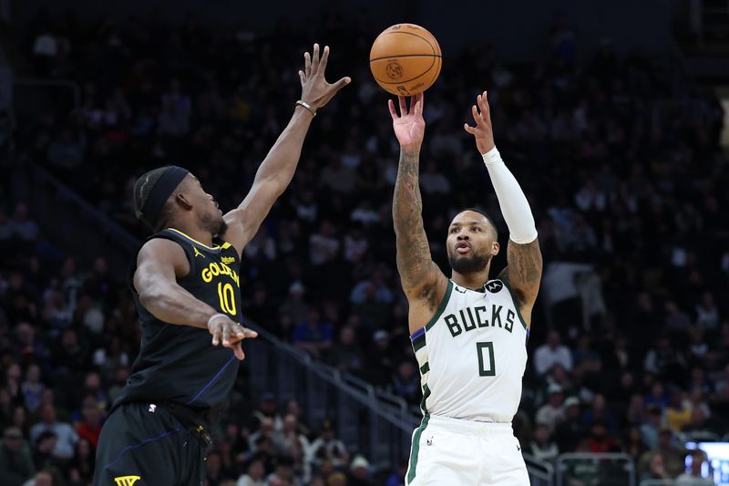 MILWAUKEE, WISCONSIN - FEBRUARY 10: Damian Lillard #0 of the Milwaukee Bucks shoots over Jimmy Butler #10 of the Golden State Warriors during the second half of a game at Fiserv Forum on February 10, 2025 in Milwaukee, Wisconsin. NOTE TO USER: User expressly acknowledges and agrees that, by downloading and or using this photograph, User is consenting to the terms and conditions of the Getty Images License Agreement. (Photo by Stacy Revere/Getty Images)