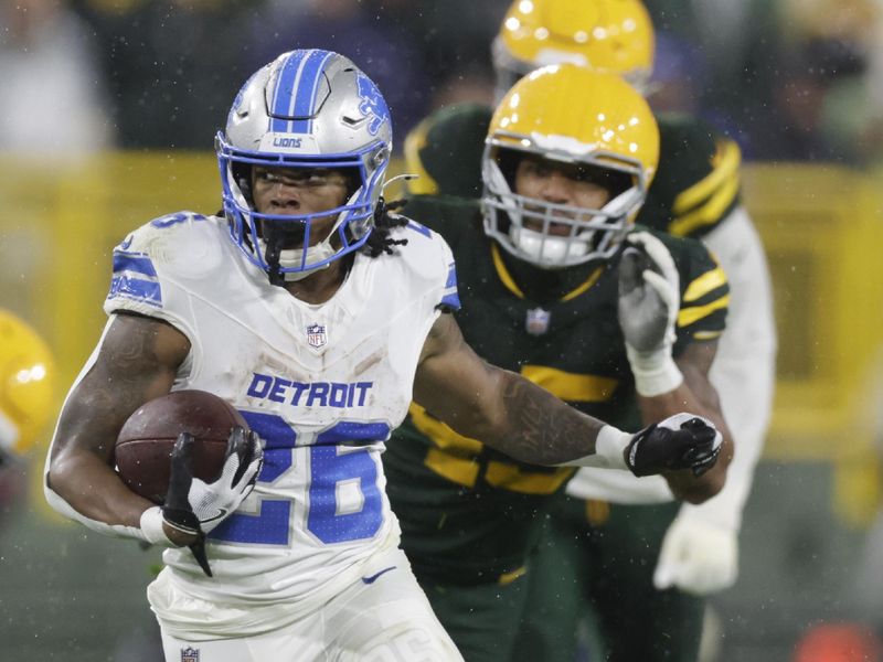 Detroit Lions running back Jahmyr Gibbs (26) runs during the second half of an NFL football game against the Green Bay Packers, Sunday, Nov. 3, 2024, in Green Bay, Wis. (AP Photo/Matt Ludtke)