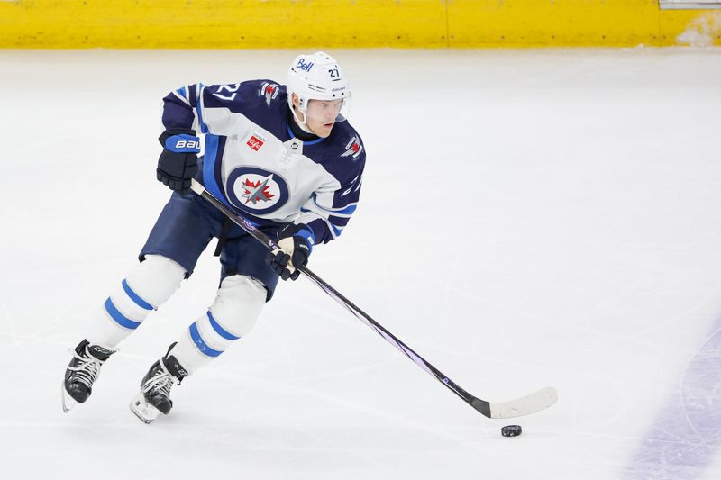 Feb 23, 2024; Chicago, Illinois, USA; Winnipeg Jets left wing Nikolaj Ehlers (27) looks to pass the ball against the Chicago Blackhawks during the third period at United Center. Mandatory Credit: Kamil Krzaczynski-USA TODAY Sports